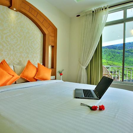 Monsoon Grande Hotel Munnar Bagian luar foto
