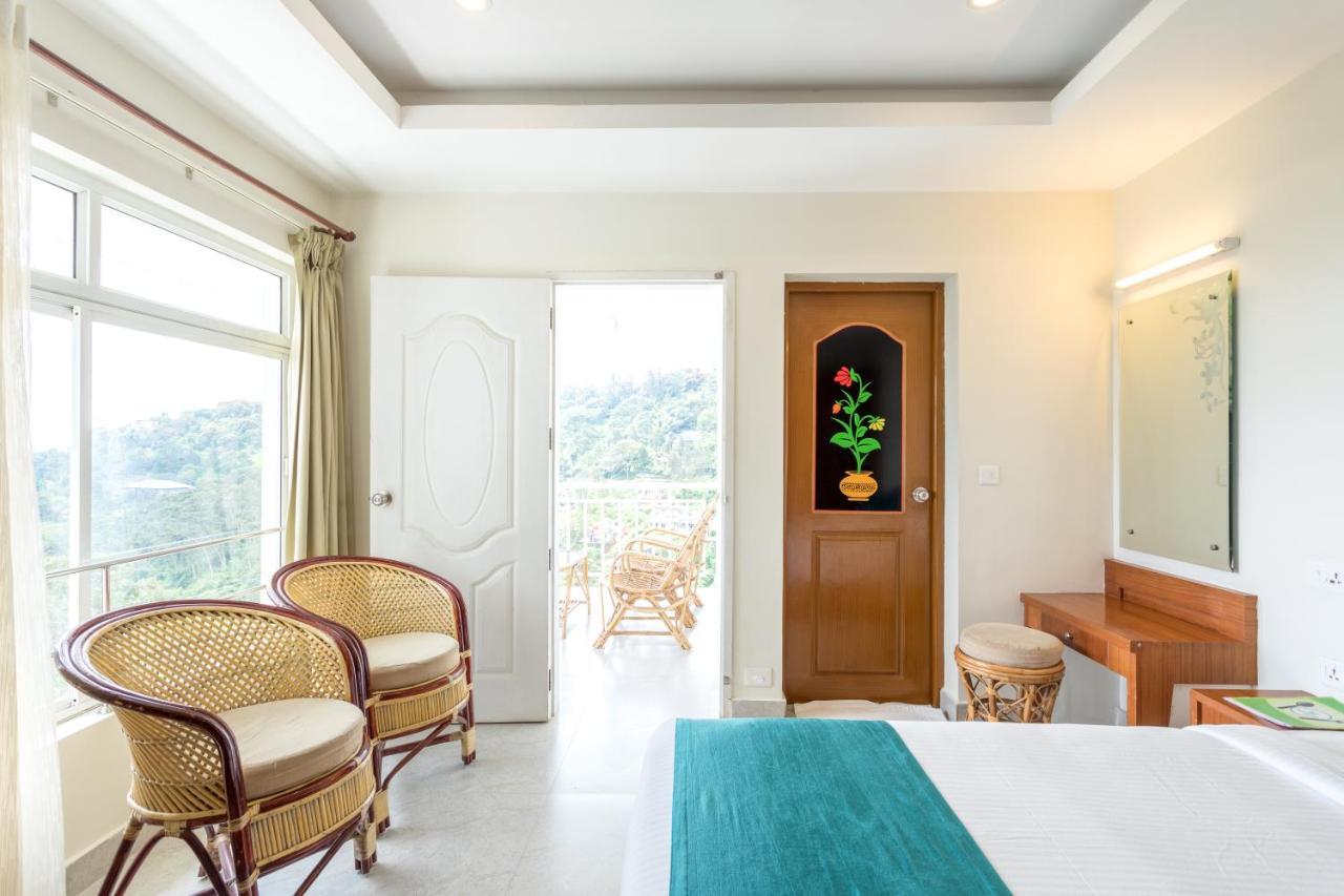 Monsoon Grande Hotel Munnar Bagian luar foto